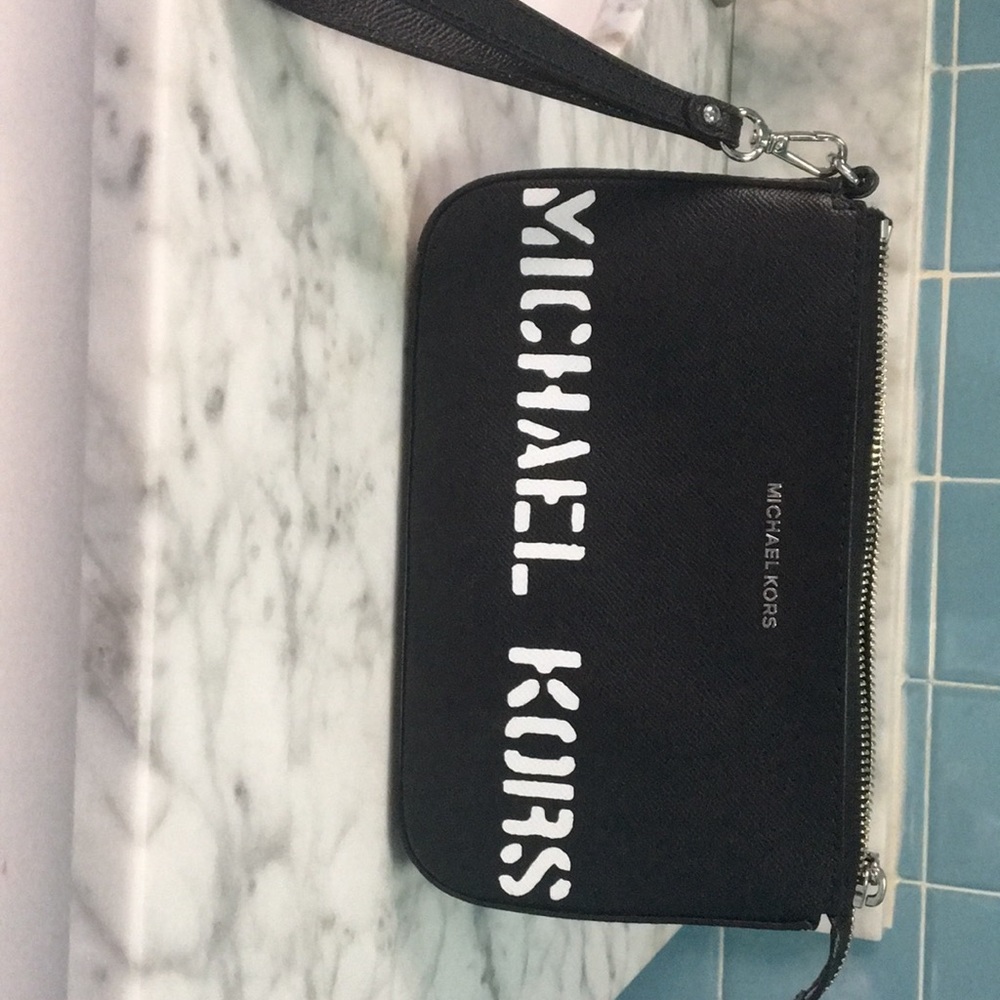 Never used Micheal Kors clutch/wristlet